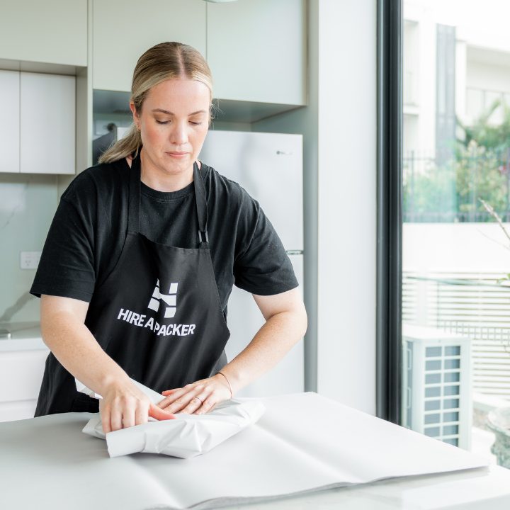 Image of Packer wrapping a fragile item